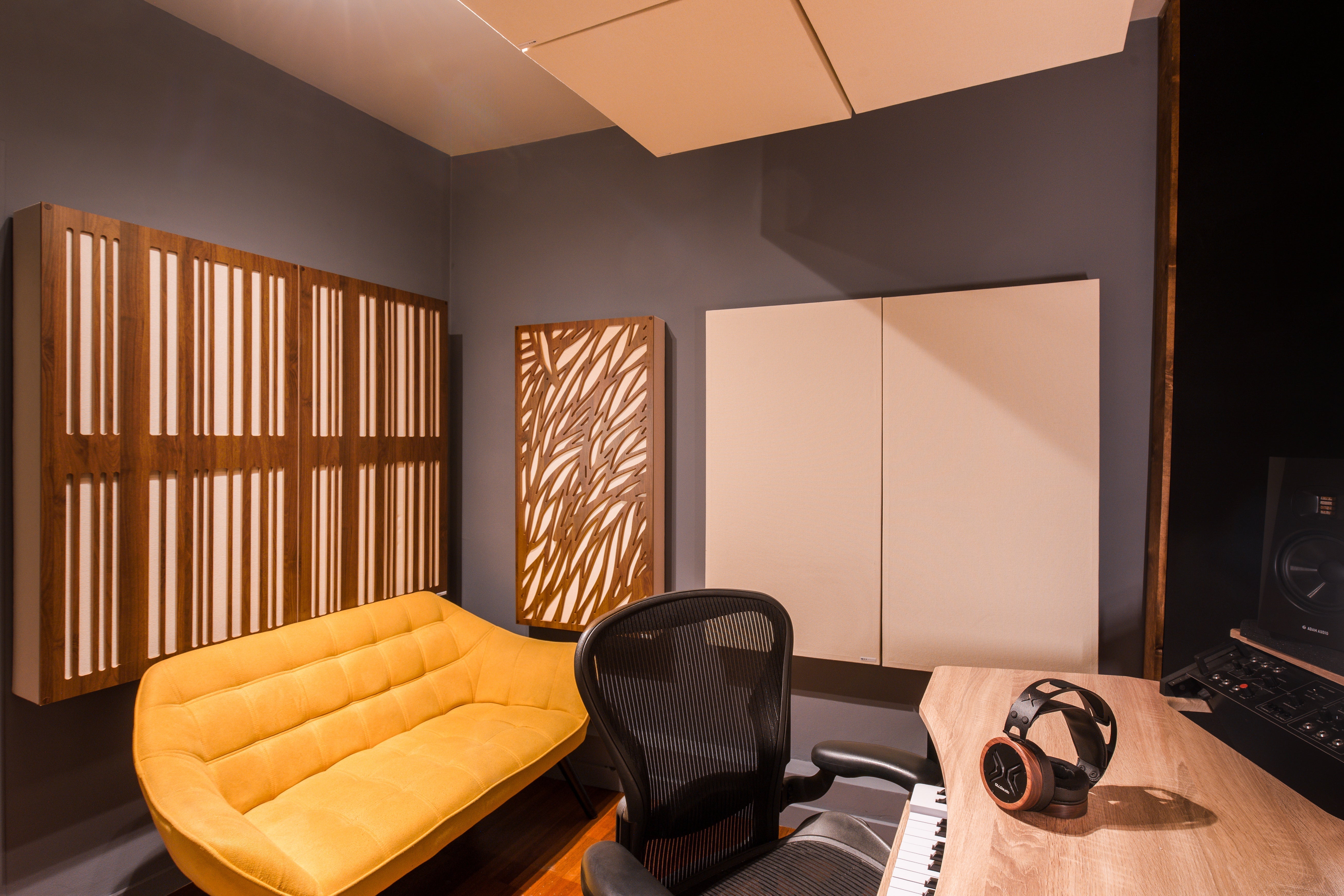 Image of a small studio featuring GIK Acoustics Panels including Amplitude Panels