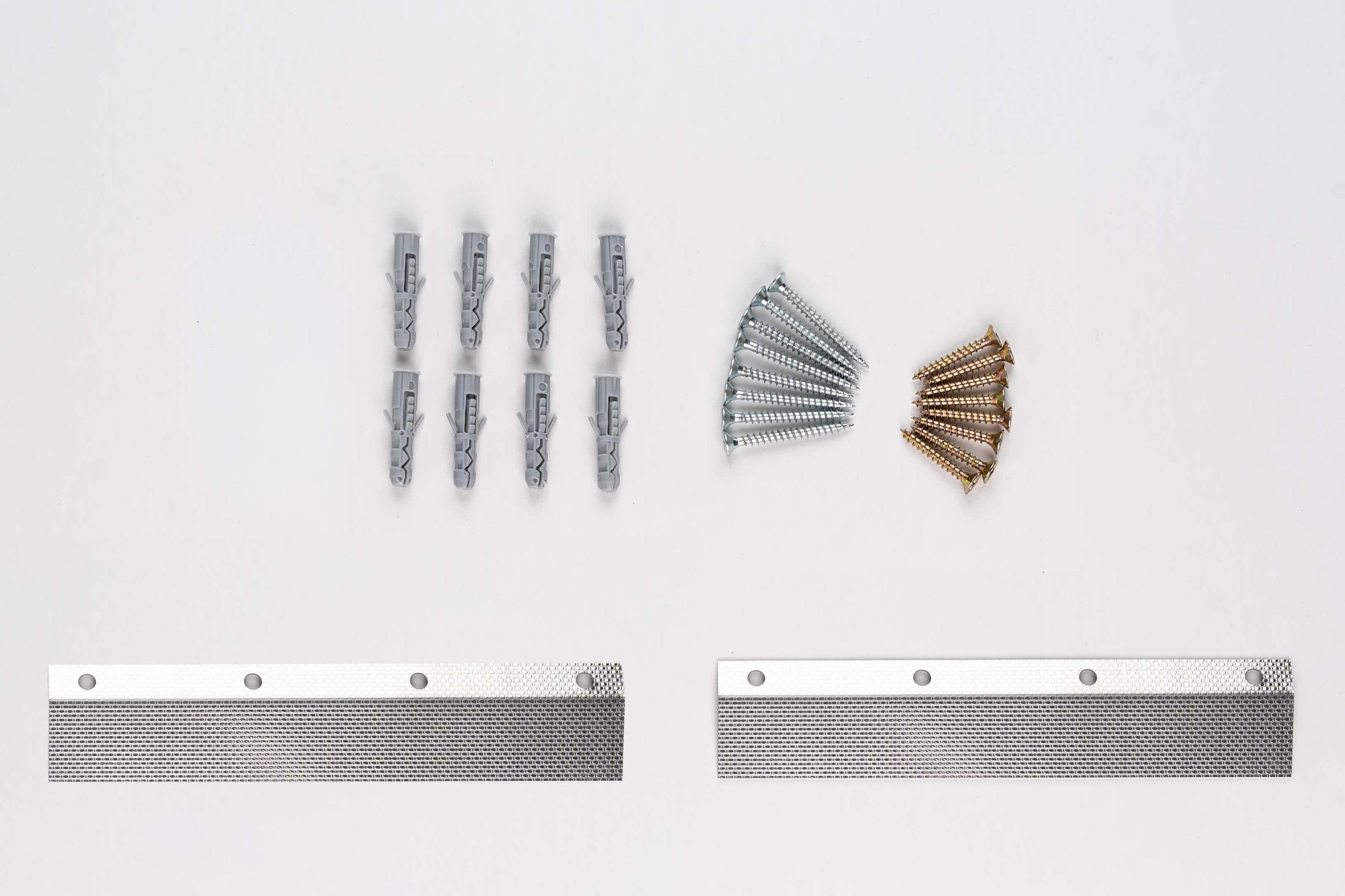 Metal brackets and screws on a white background